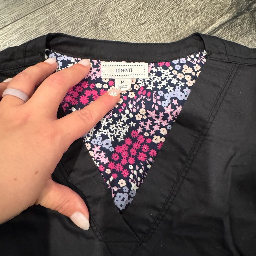 Maevn Women's Black Top with Floral Accent